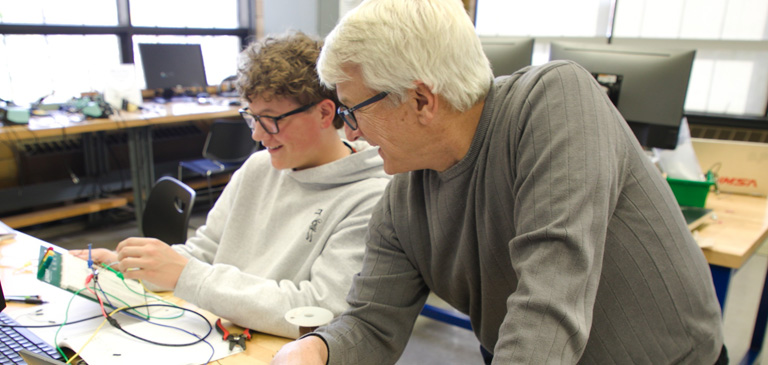 student and faculty in classroom