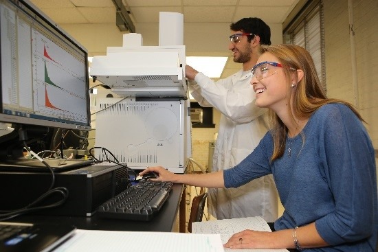 student in lab viewing graph